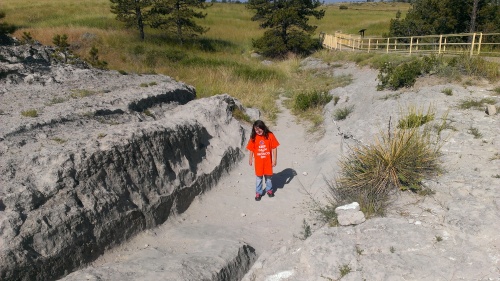 Zari in the Oregon Trail Ruts at Guernsey State Park